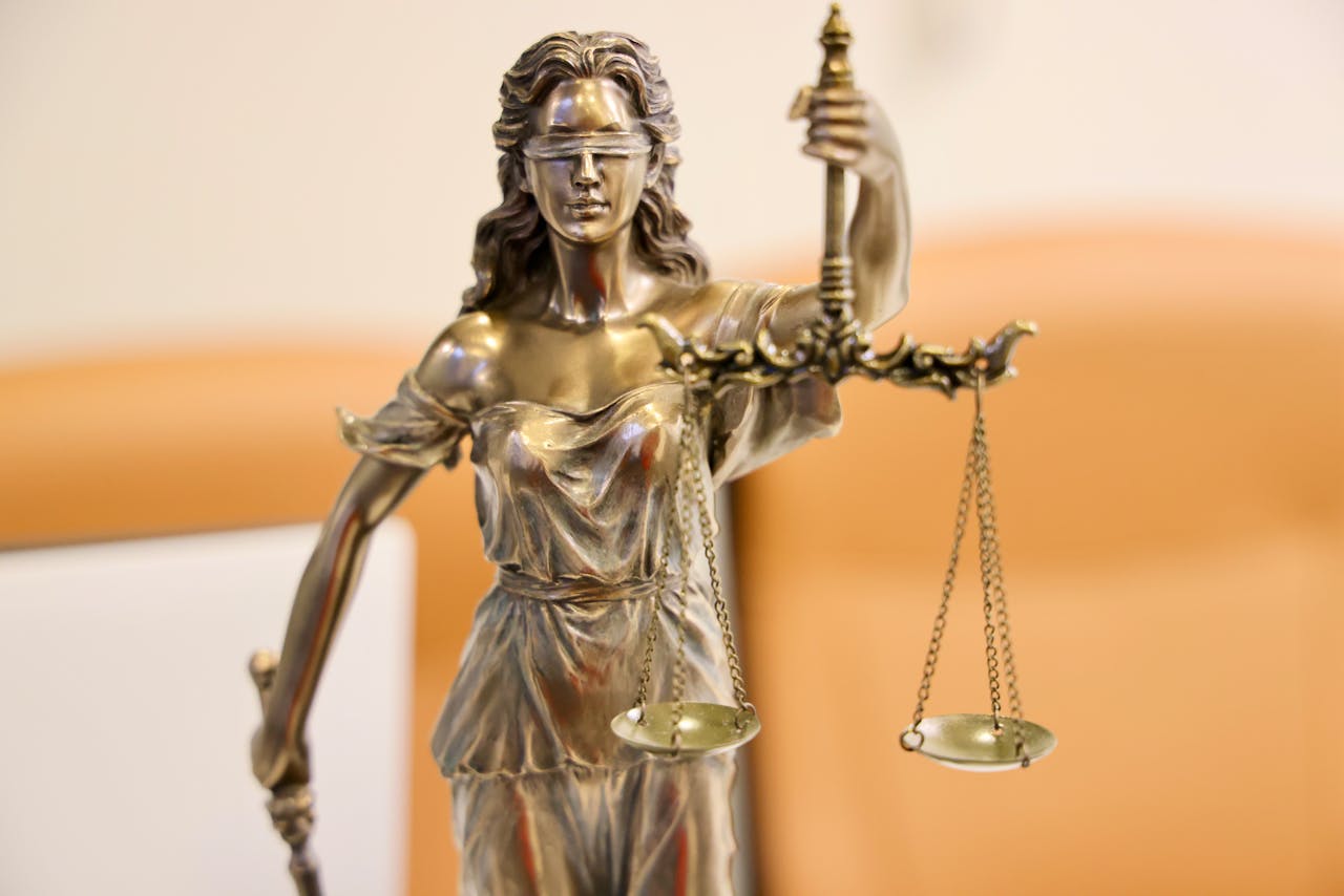 Detailed image of Lady Justice statue, symbolizing fairness and impartiality.